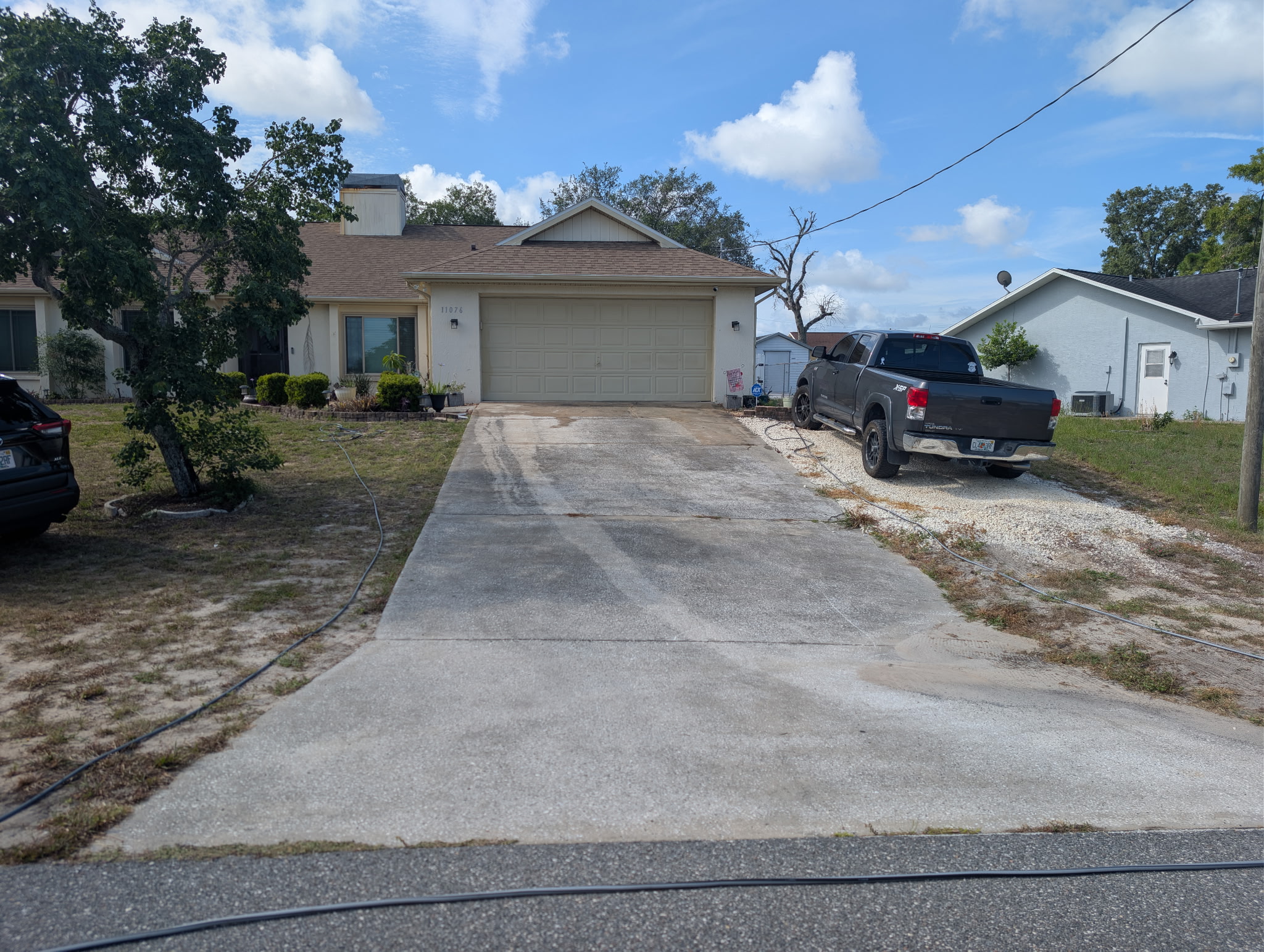 Home driveway before cleaning — dull and dirty